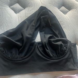 Black halter top with criss cross backing. From Akira. Size 4 never worn.